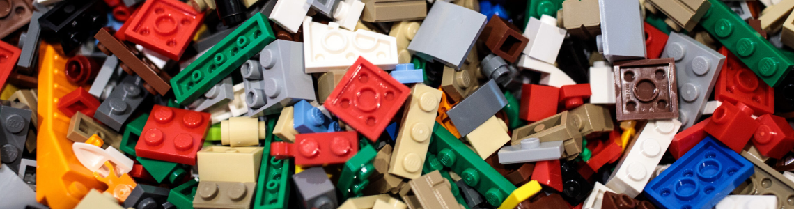 An assortment of LEGO bricks in neutral colours